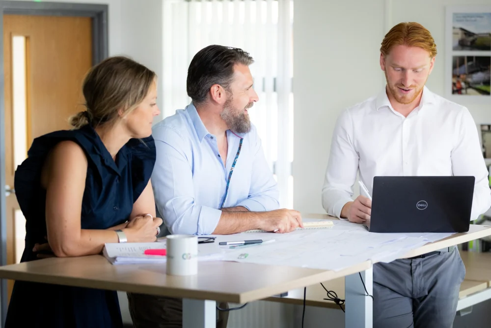3 people in a meeting.