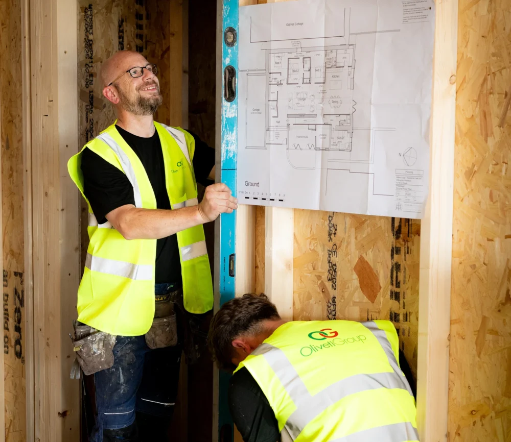 2 staff members working with plans